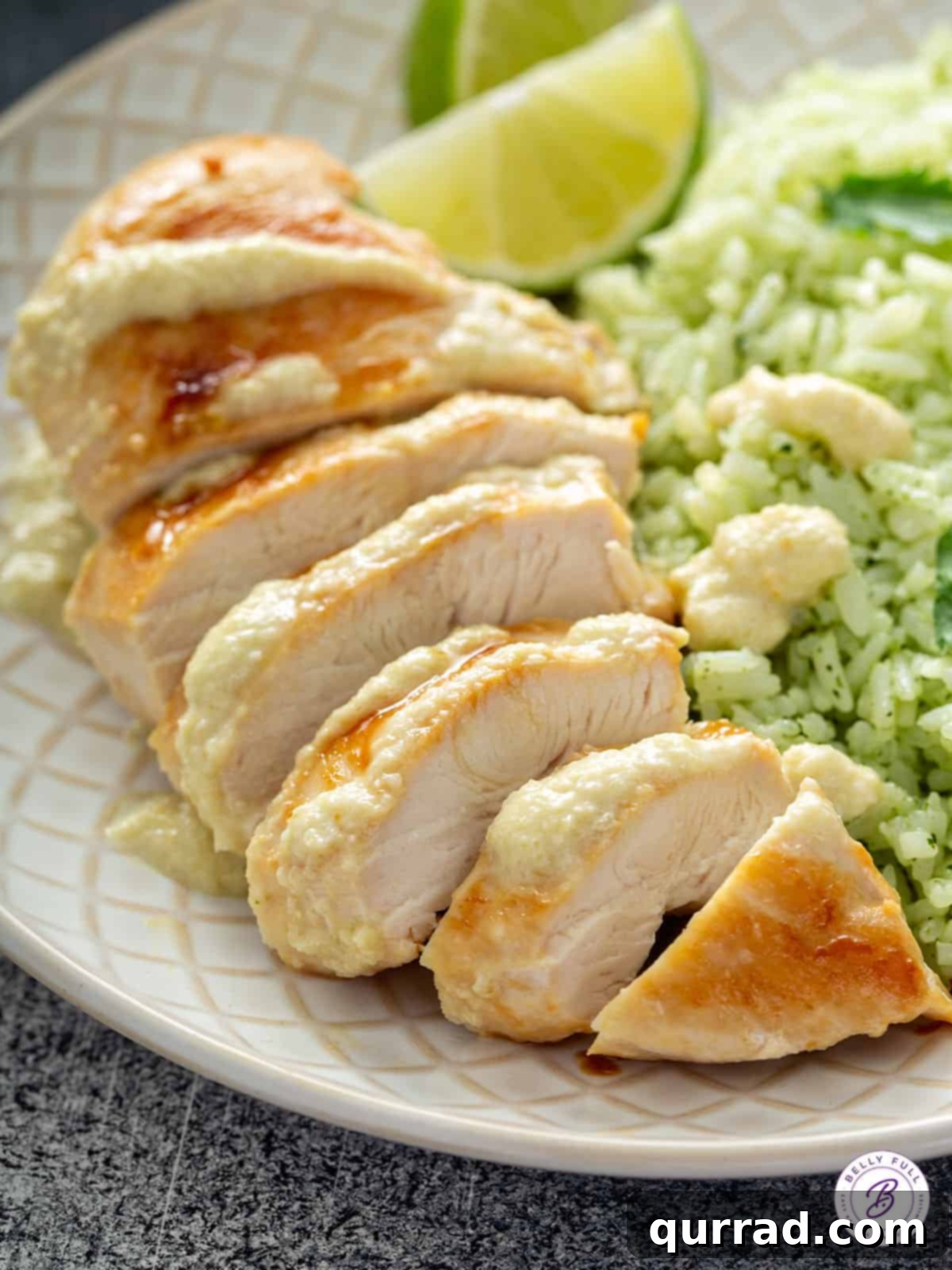 Golden brown sliced chicken breast with chile cream sauce drizzled over it