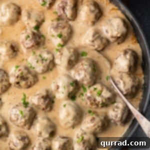 overhead skillet of gravy smothered Swedish meatballs