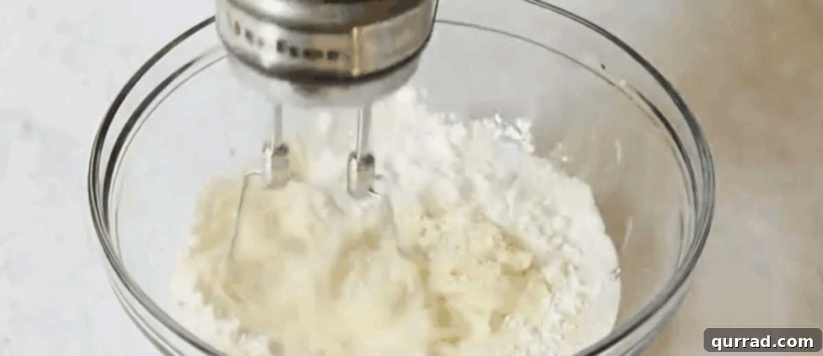 Blending the cheese mixture.
