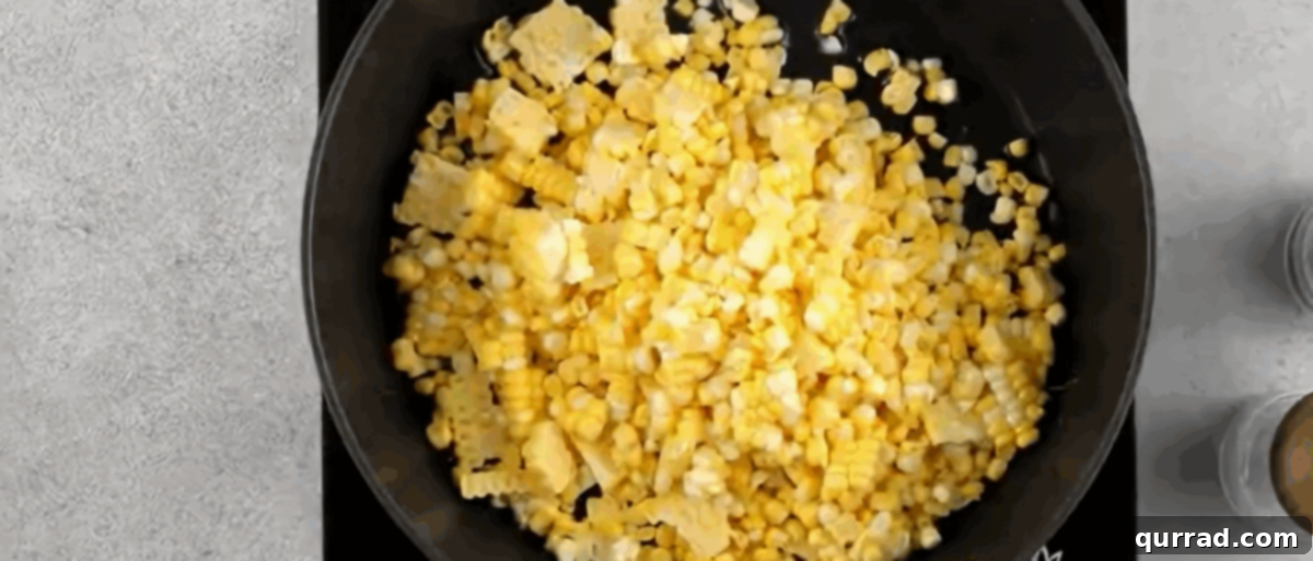 Creamy Cotija Esquites Bowl 3 Cooking the corn in a skillet to achieve a light char.