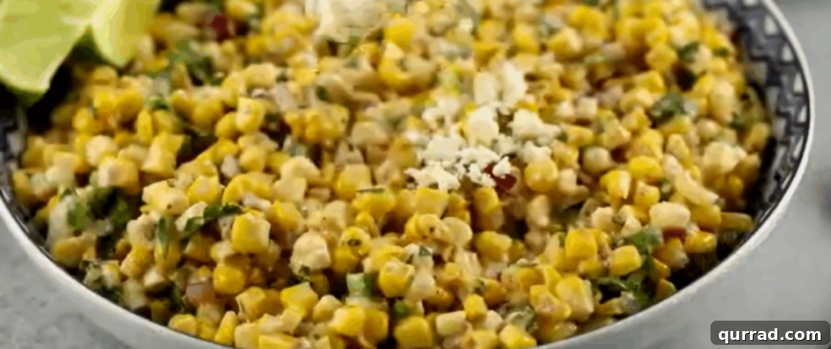 Creamy Cotija Esquites Bowl 5 Combining the dressing with the cooled corn, cheese, and fresh ingredients.