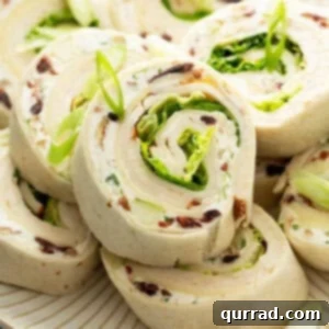 close up of chicken salad tortilla roll ups on plate