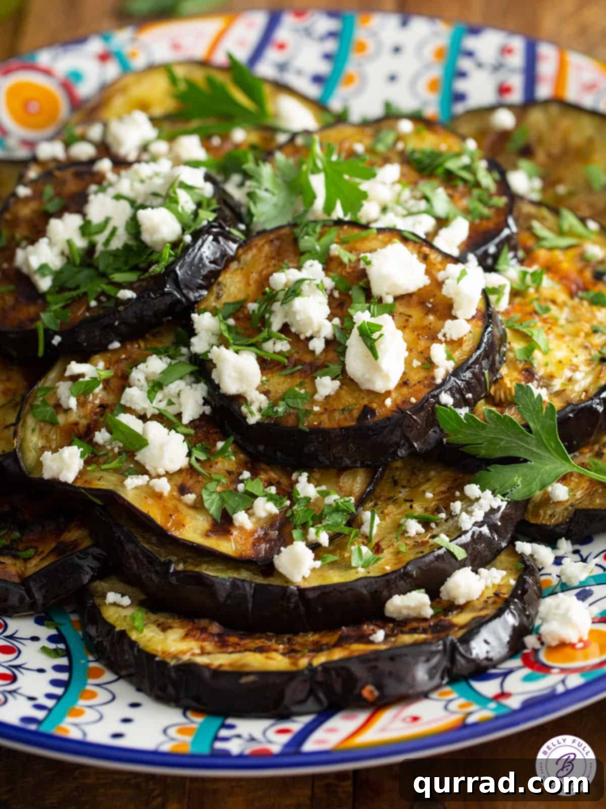 Fire-Kissed Eggplant 3 cooked sliced eggplant with crumbled feta
