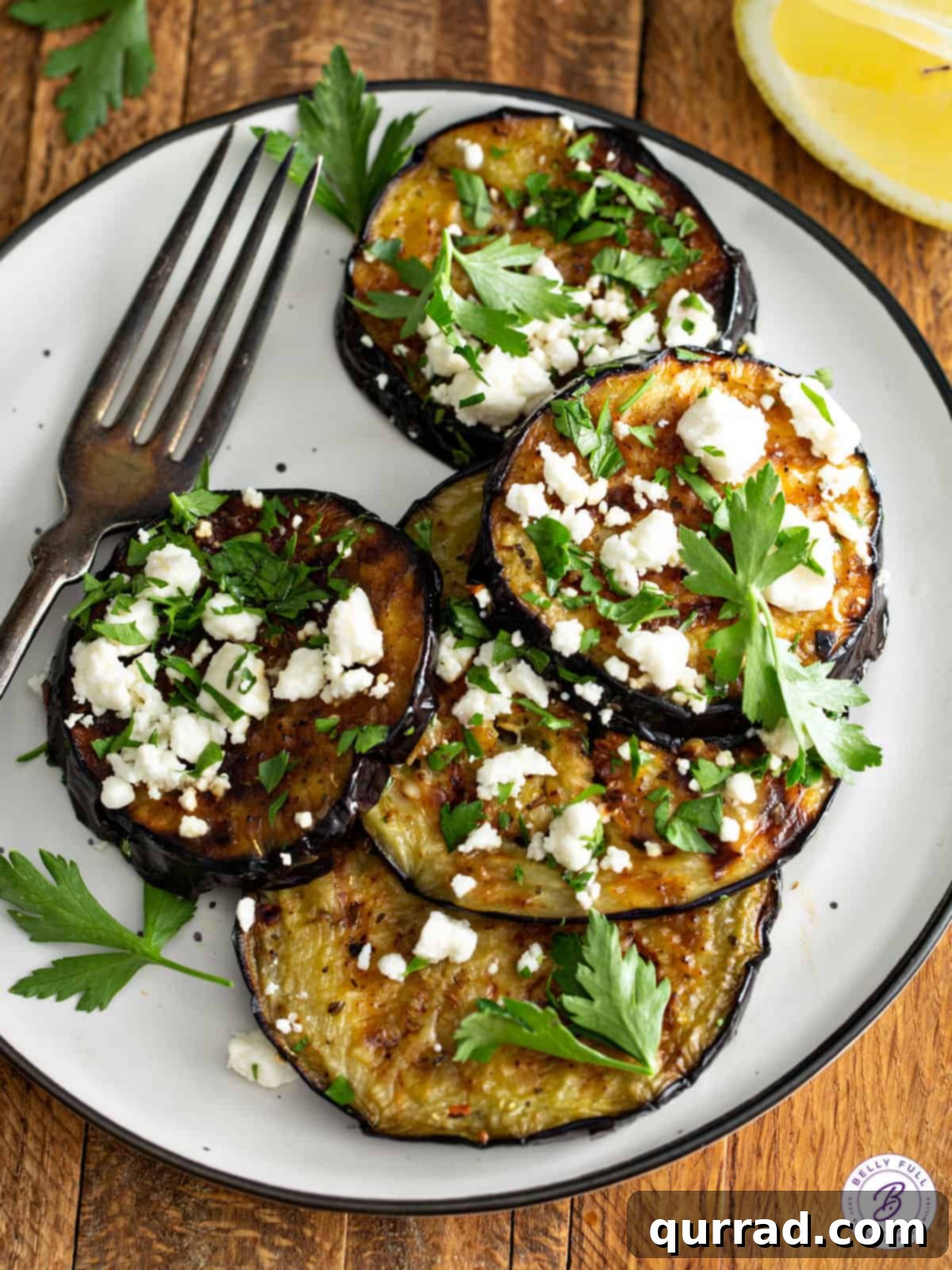 Fire-Kissed Eggplant 5 plate of grilled eggplant with feta cheese and parsley