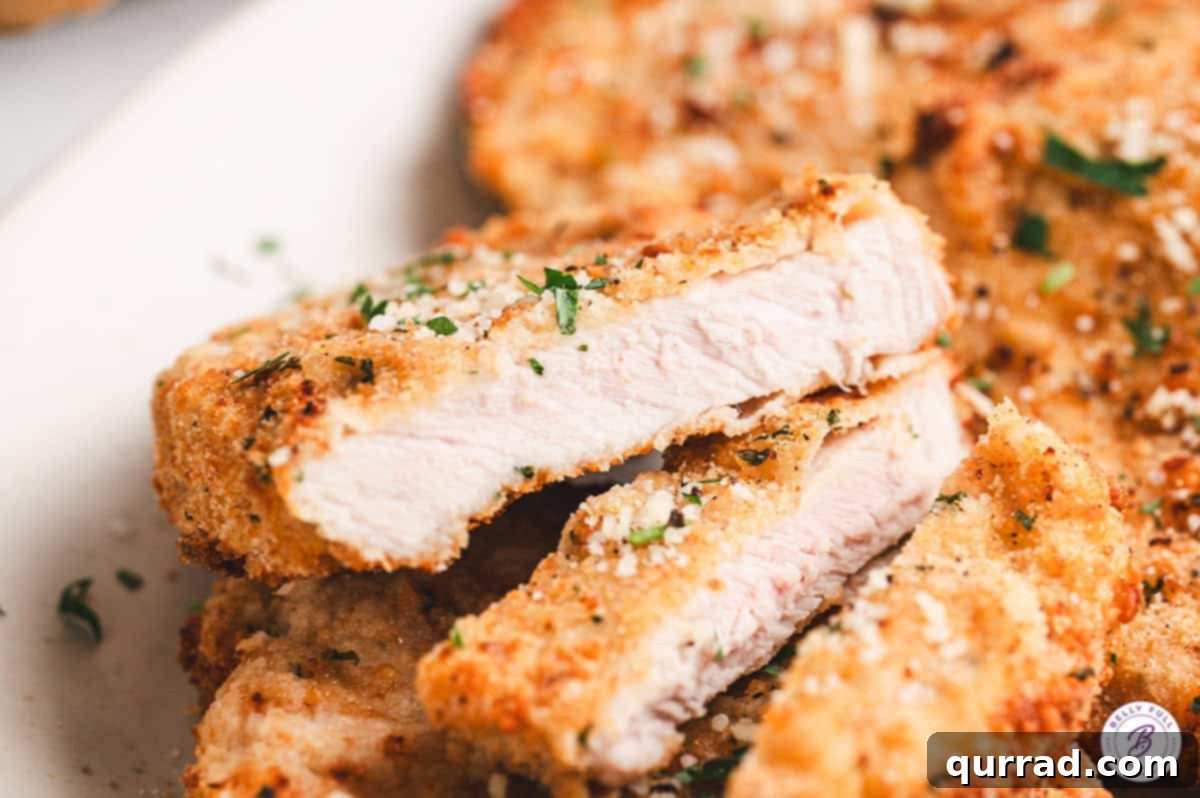 Crispy Air Fryer Pork Chops 10 Close-up of perfectly sliced crispy breaded air fryer pork chops, revealing tender meat