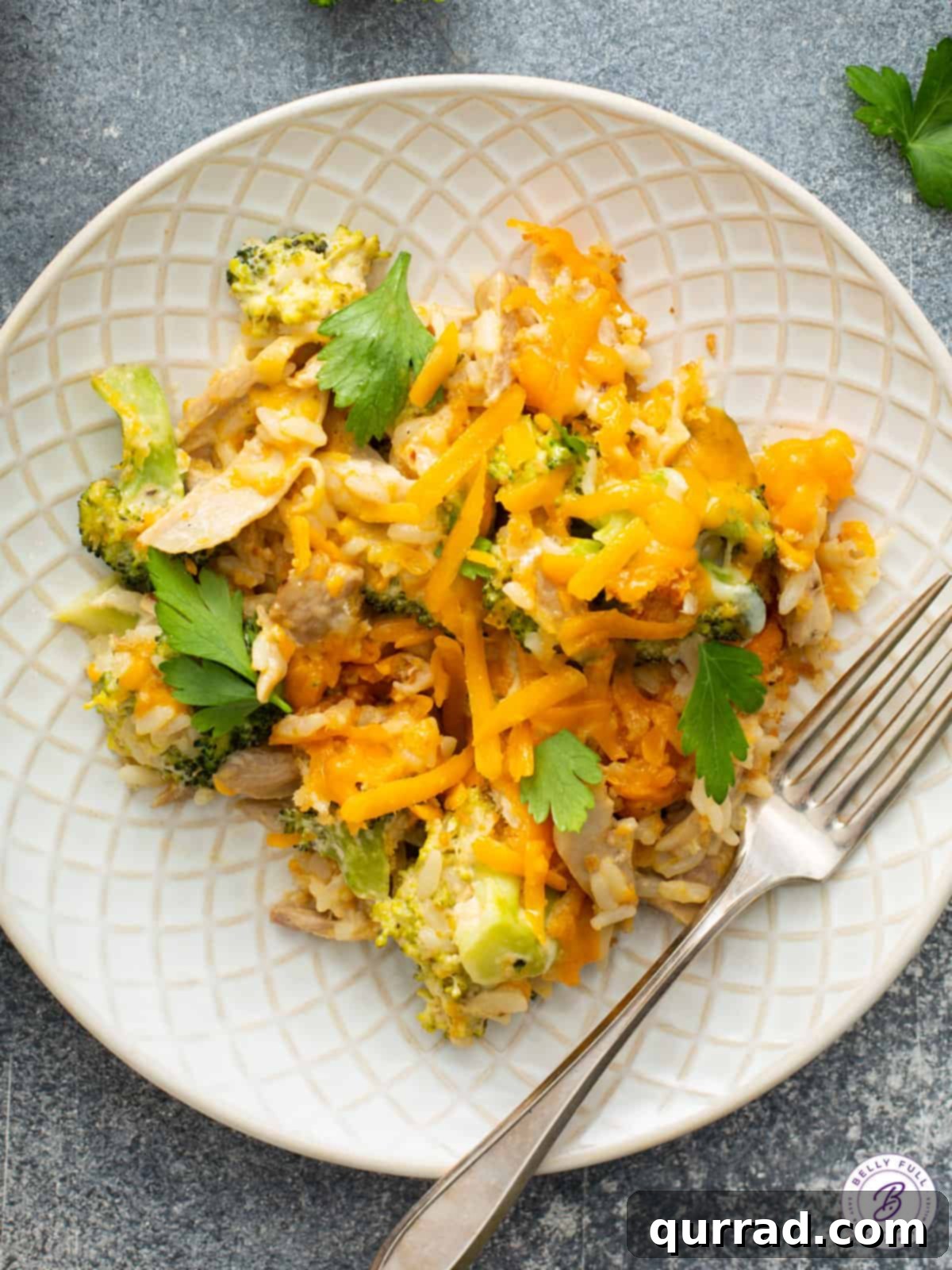 Hearty Chicken Broccoli Rice Bake 3 overhead plateful of creamy broccoli and rice with fork