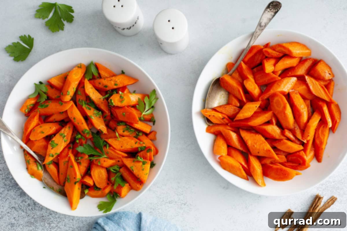 Golden Roasted Carrots 7 Two bowls of finished oven roasted carrots, garnished with green herbs, ready to be served.