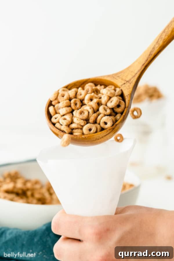 Hot Buttered Doughnut O's 4 mini doughnut hot buttered Cheerios on wooden serving spoon