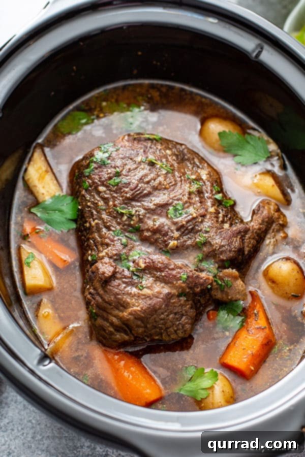 Melt in Your Mouth Slow Cooker Pot Roast 2 Cooked chuck roast in a slow cooker with tender vegetables and rich gravy.