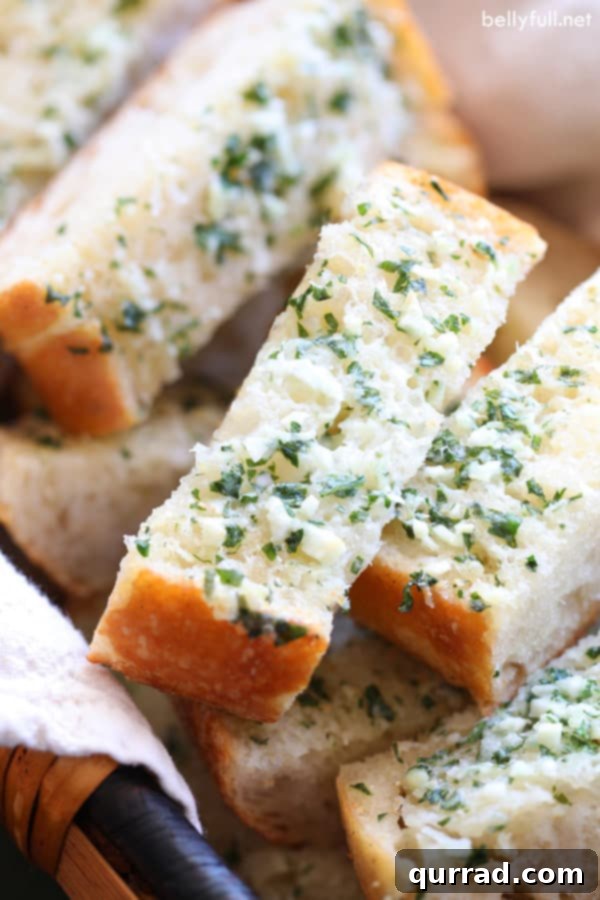 Golden-brown garlic bread, toasted to perfection, ready to serve.