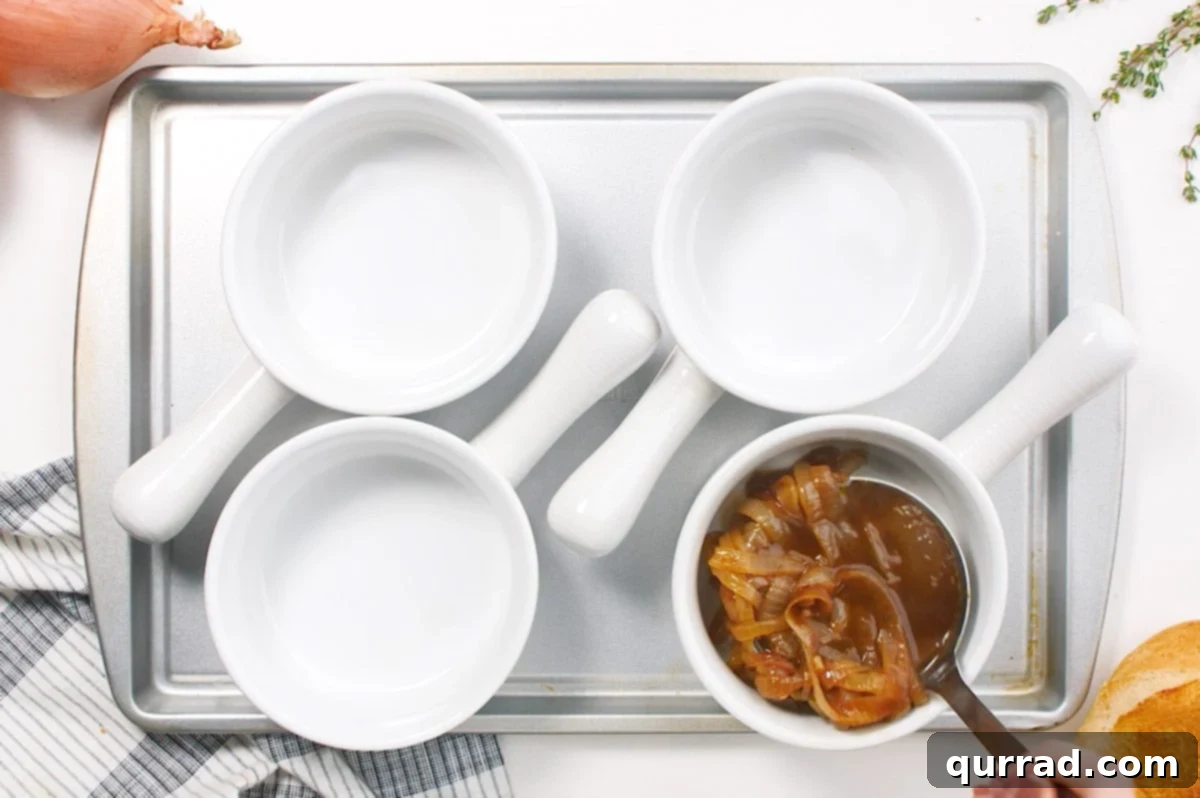 french onion soup ladled into soup crocks
