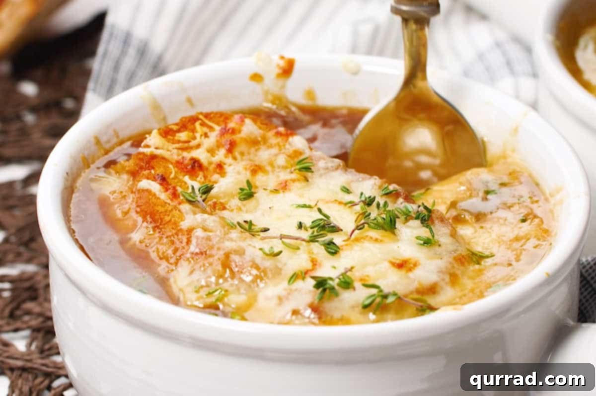 bowl of french onion soup with bread and melty cheese