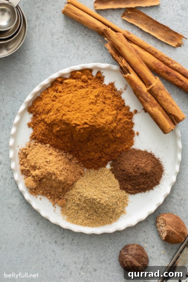 Signature Apple Pie Spice Blend 3 separated spices for apple pie spice on white plate