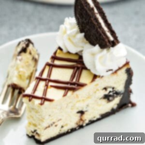 cheesecake with with bite taken, garnished with an Oreo and whipped cream