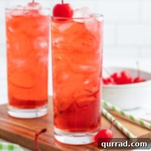 Shirley Temple Drink in a highball glass with a cherry garnish, ready to be served.