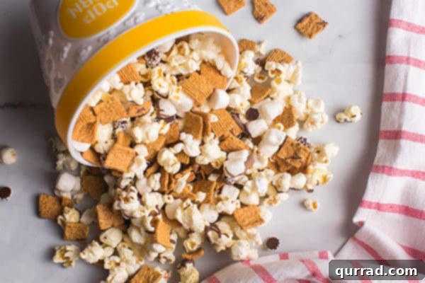 popcorn snack mix pouring out of bowl