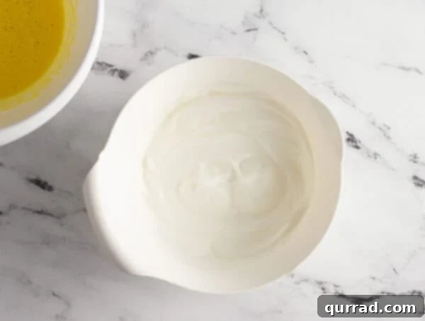 whipped egg whites in mixing bowl