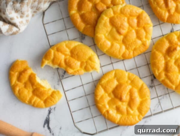 baked puffy golden cloud bread on wire cooling rack