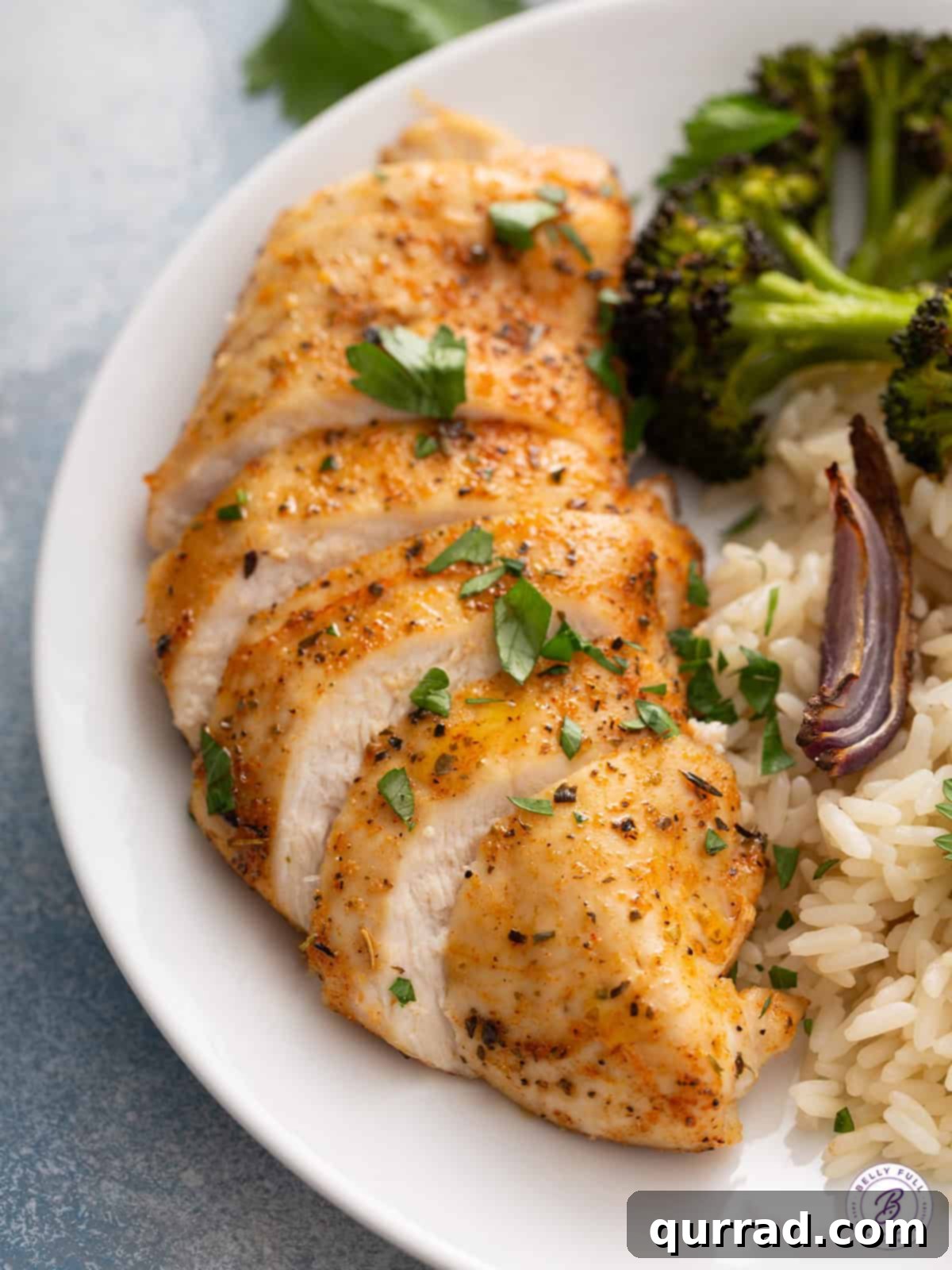sliced seasoned baked chicken breast on plate