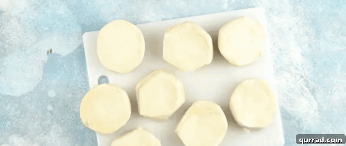 Quick Air Fryer Donut Delight 4 Separating the biscuit dough.