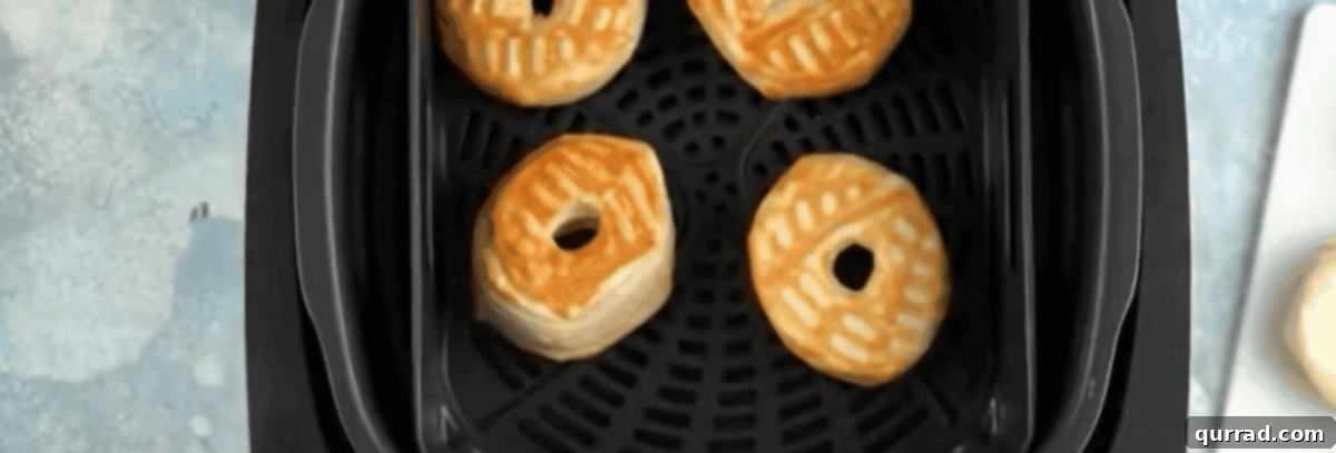 Quick Air Fryer Donut Delight 6 Golden air fryer donuts in the air fryer.