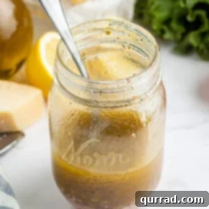 Italian dressing in glass mason jar with spoon