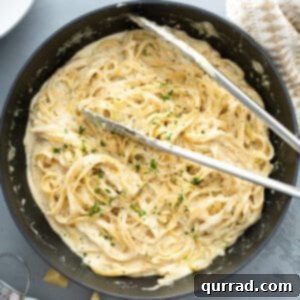 overhead pan with cooked fettuccine Alfredo