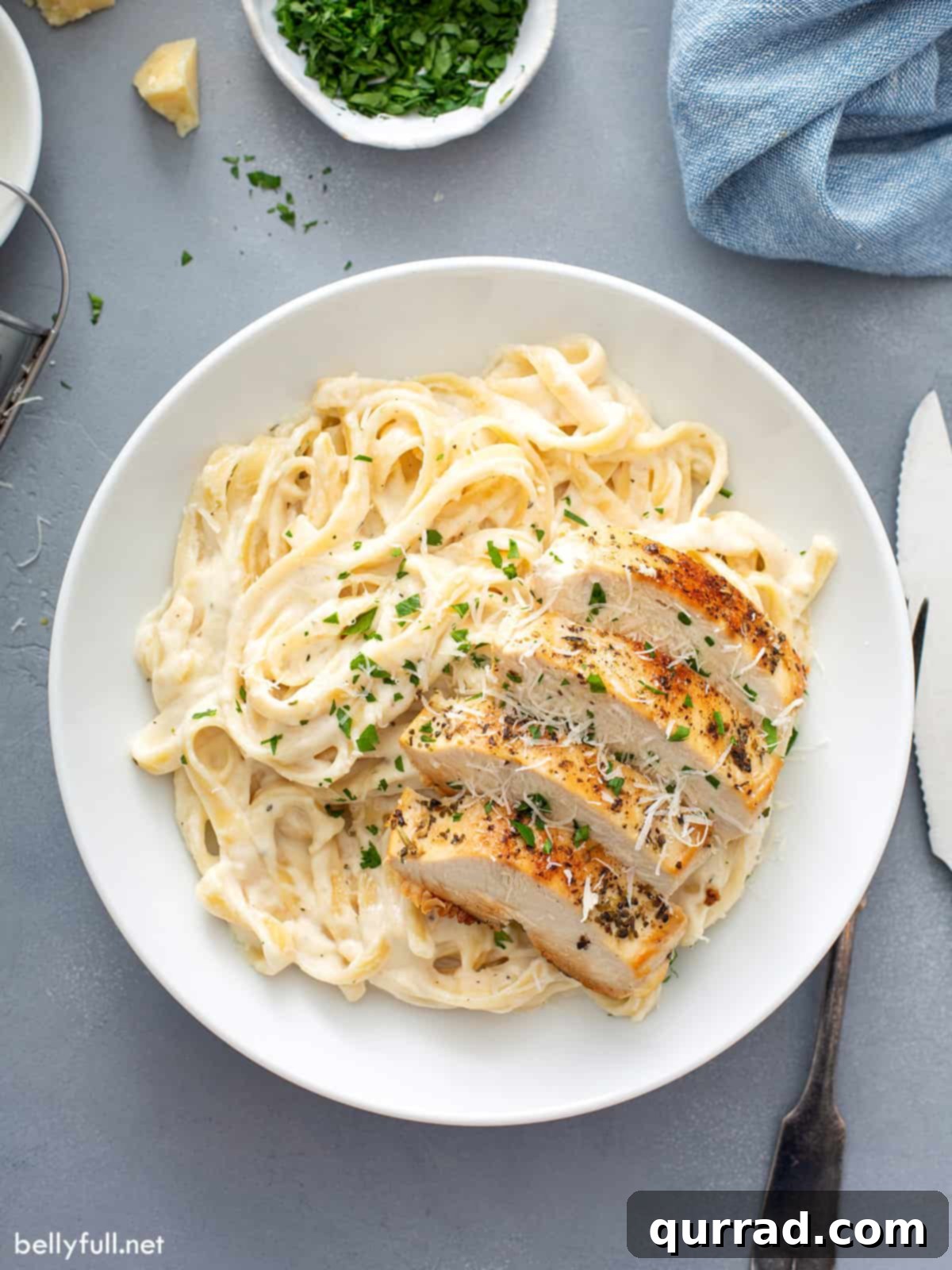 Ultimate Chicken Alfredo 4 overhead of Chicken Alfredo serving on white plate