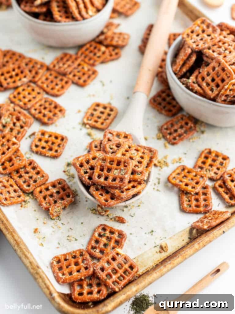Zesty Ranch Pretzels 4 A generous bunch of freshly baked Ranch Pretzels resting on a serving spoon, highlighting their golden color and ample seasoning.