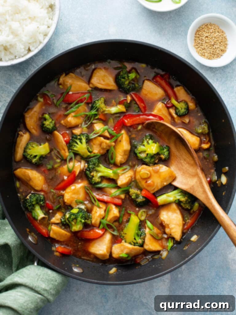 Quick Chicken Stir-Fry 2 chicken stir fry in skillet with wooden spoon