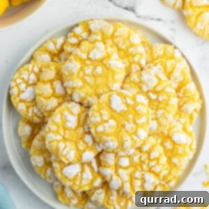 plate stacked with lemon crinkle cookies