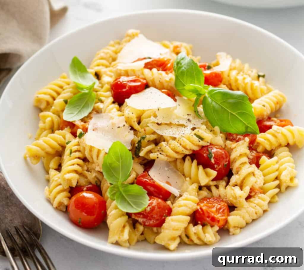 Creamy Tomato Feta Pasta Bake 4 feta and tomato pasta with fresh basil leaves in bowl