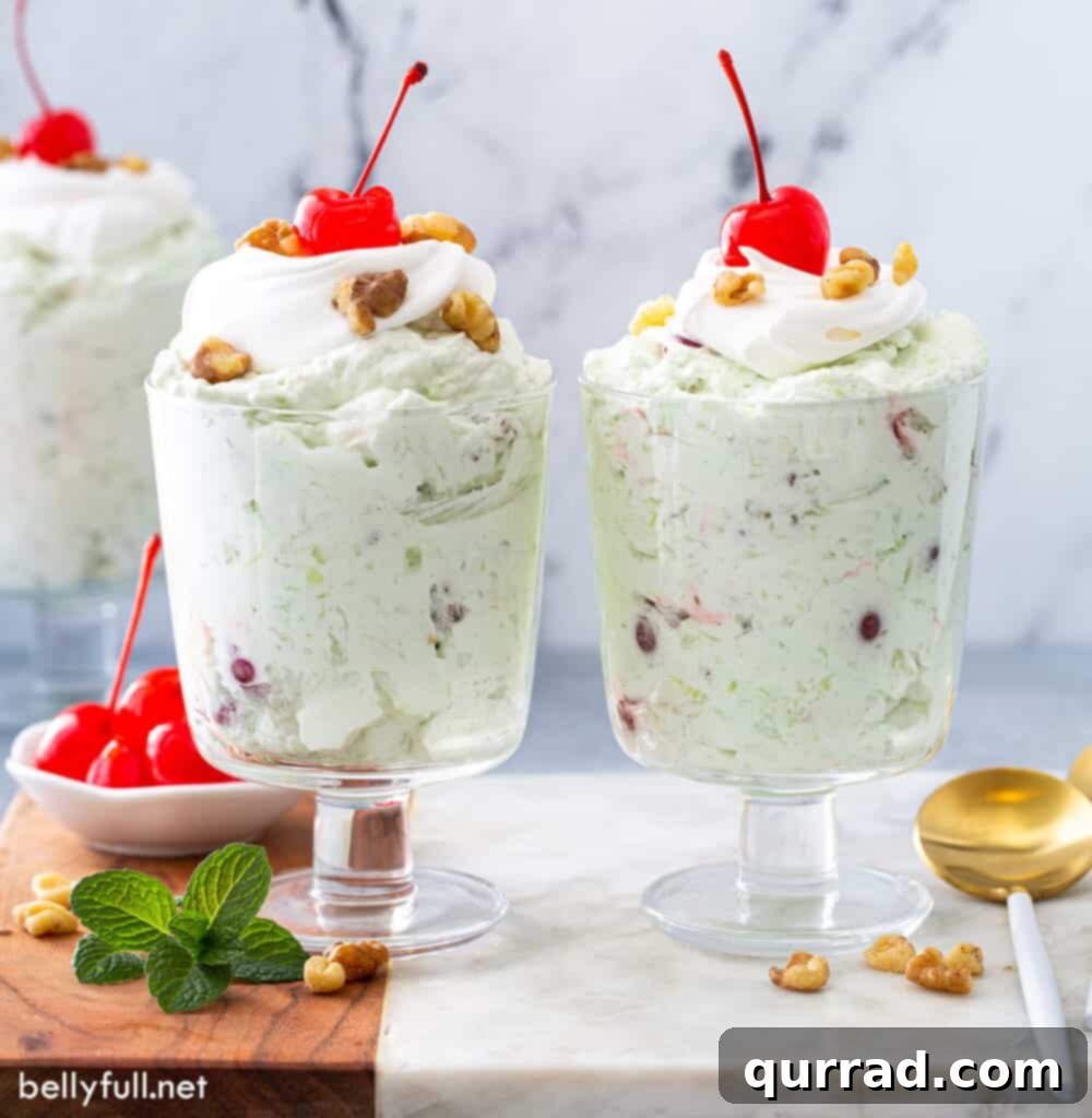 Pistachio Cloud Salad 6 Two parfait glasses filled with Watergate Salad (Pistachio Fluff), ready to be served.