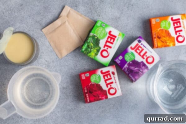 Boxes of lime, orange, grape, and cherry Jello gelatin on a counter.
