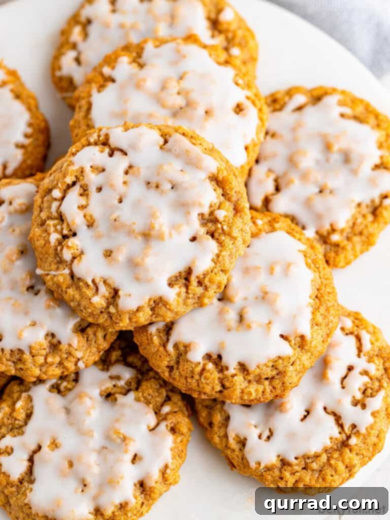 Frosted Cinnamon Oat Cookies 2 top down close up stack of iced oatmeal cookies