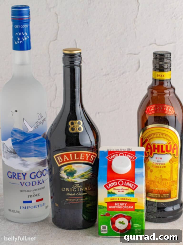 Essential ingredients for crafting a delicious Mudslide cocktail: Irish cream, coffee liqueur, vodka, heavy cream, and chocolate syrup