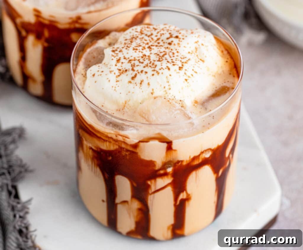 Rich and creamy Mudslide cocktail served in a clear lowball glass, ready to be enjoyed as a delightful dessert drink