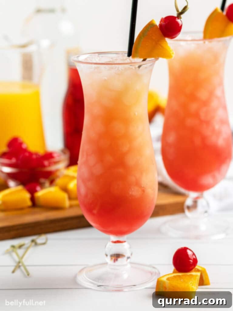 Tropical Sunset Sip 2 Sex on the Beach drink in a elegant hurricane glass, garnished with fresh fruit slice and a cherry, set against a summer backdrop.