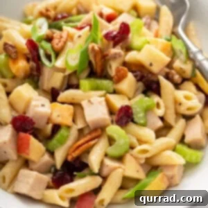 Crisp Apple Turkey Pasta Salad 7 portion of turkey apple pasta salad in white bowl