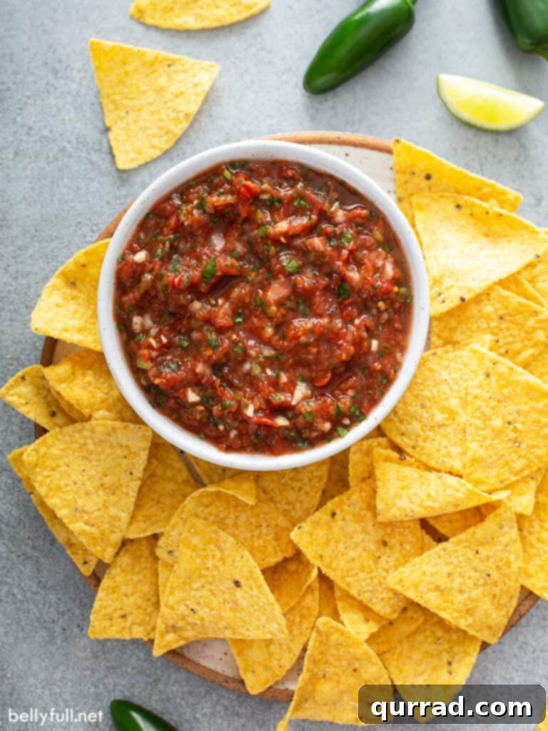 overhead salsa in white dish surrounded by tortilla chips