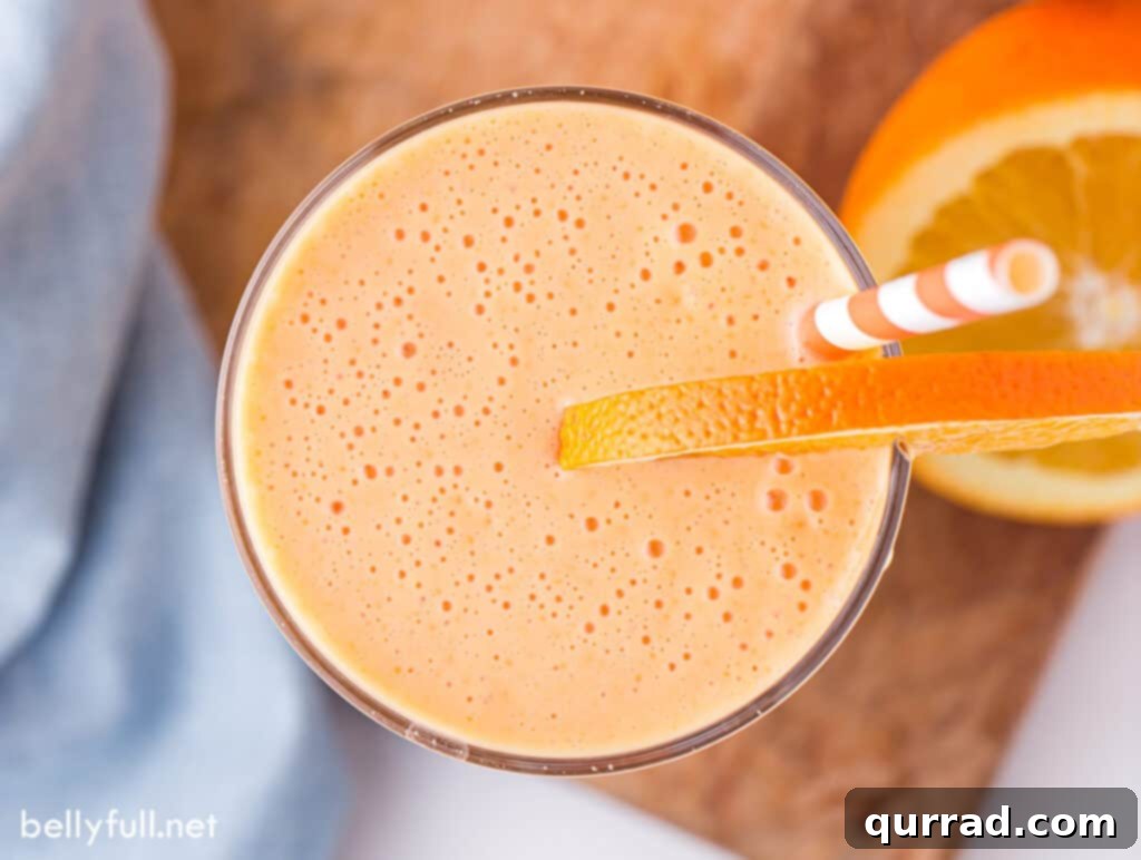Creamy Orange Dream 5 Overhead shot of an Orange Julius in a glass, garnished simply with an orange slice