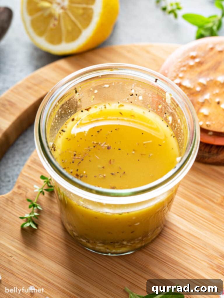 Homemade Greek Salad Dressing in a glass jar, perfectly blended and ready to enhance any dish.