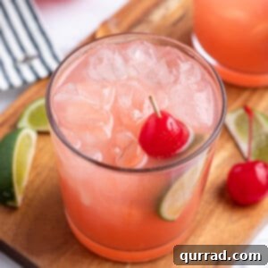 Crimson Tide Refresher 5 Sea Breeze Cocktail in high ball glass with cherry garnish