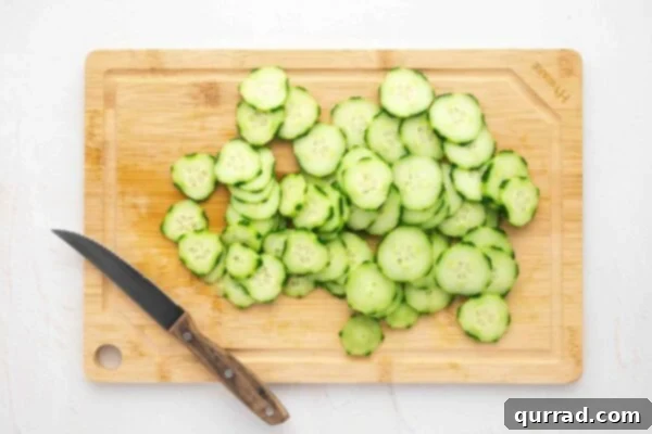 Finely sliced cucumber rounds, perfectly uniform for delicate sandwiches.