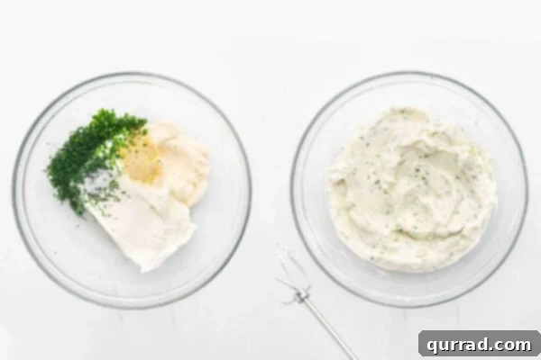 Cream cheese, mayonnaise, and fresh herbs being blended together for the sandwich spread.