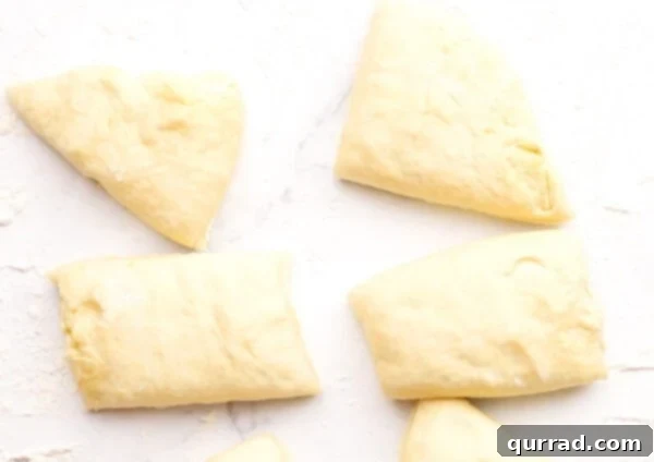 Pillowy Indian Flatbread 8 Dough divided into 8 small, equal sections on a floured surface