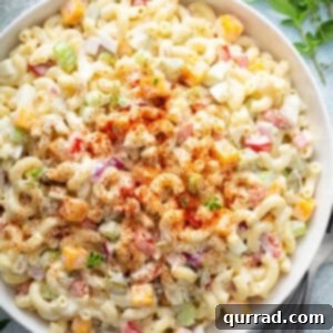 A smaller, focused image of a bowl of macaroni salad with egg