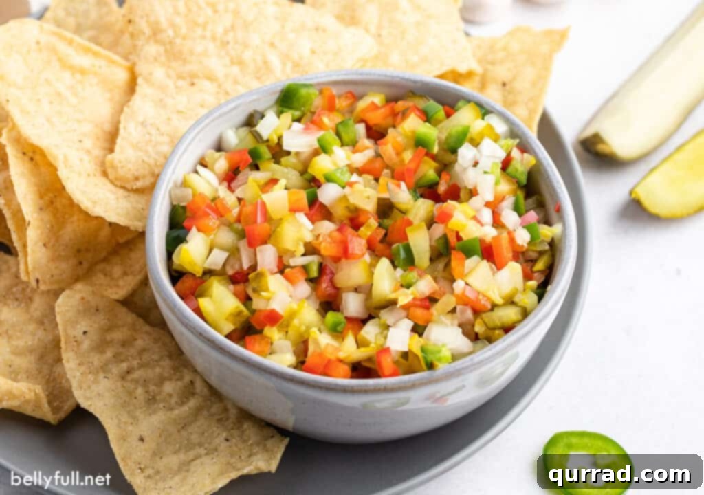 Dill Pickle de Gallo 4 Close-up shot of Pickle de Gallo in a bowl, showcasing its vibrant colors and chunky texture, ready to be enjoyed.