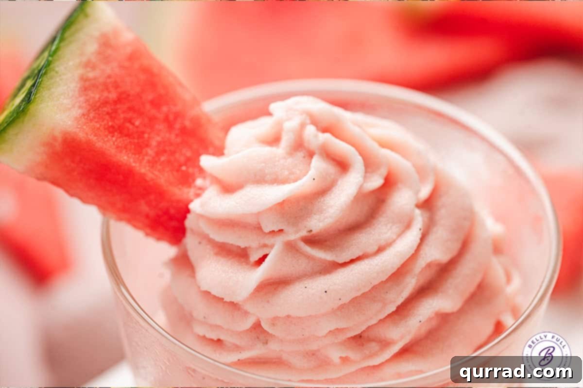 Close-up artistic shot of a dish of watermelon dole whip, highlighting its texture and vibrant color.