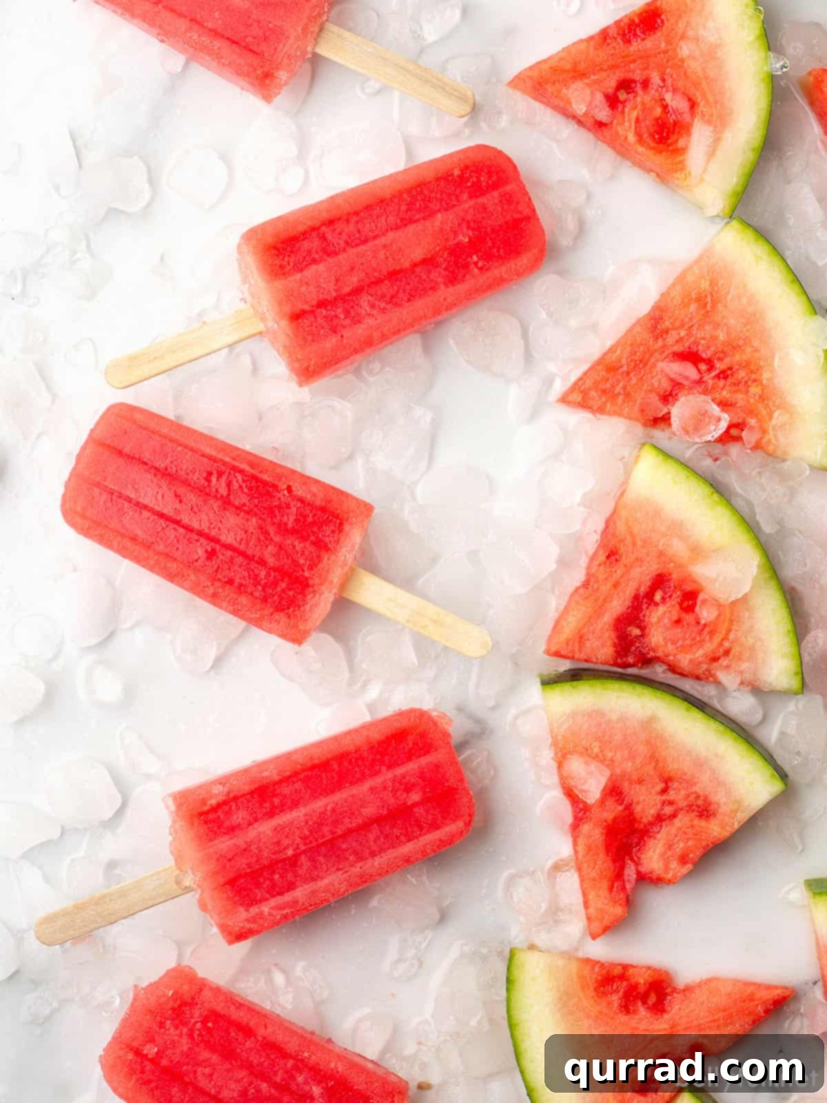 Refreshing Watermelon Ice Pops 5 A vibrant display of homemade watermelon popsicles alongside fresh watermelon slices, emphasizing their natural goodness and summery appeal.